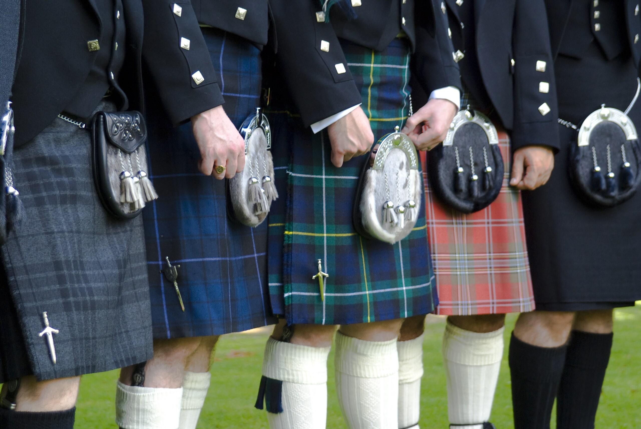 Men in tartan kilts Men in tartan kilts