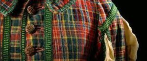 A Royal Scottish tartan coat on a mannequin. A Royal Scottish tartan coat on a mannequin.