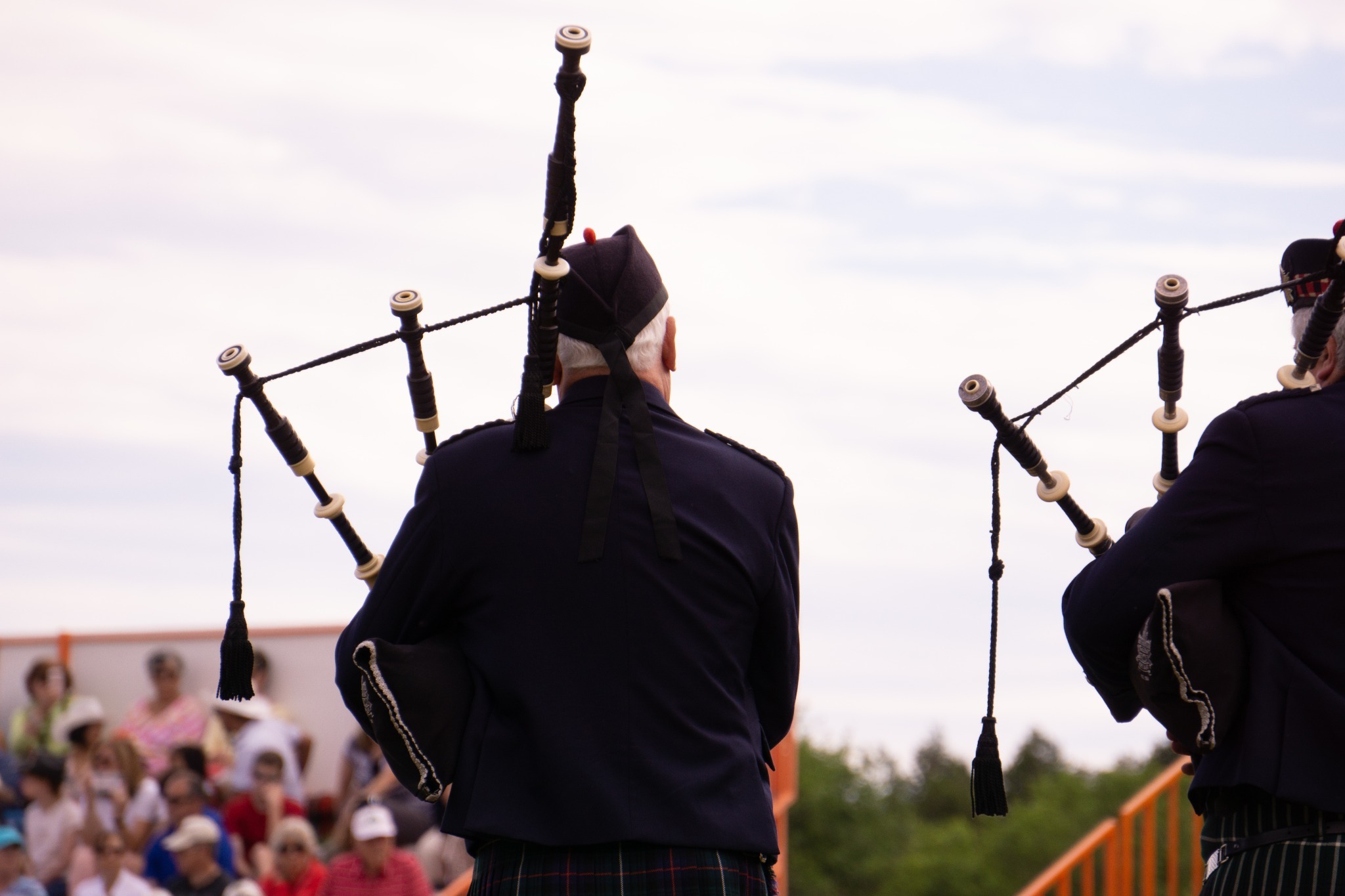 Gentlemen playing bagpipes at a modern event. Gentlemen playing bagpipes at a modern event.