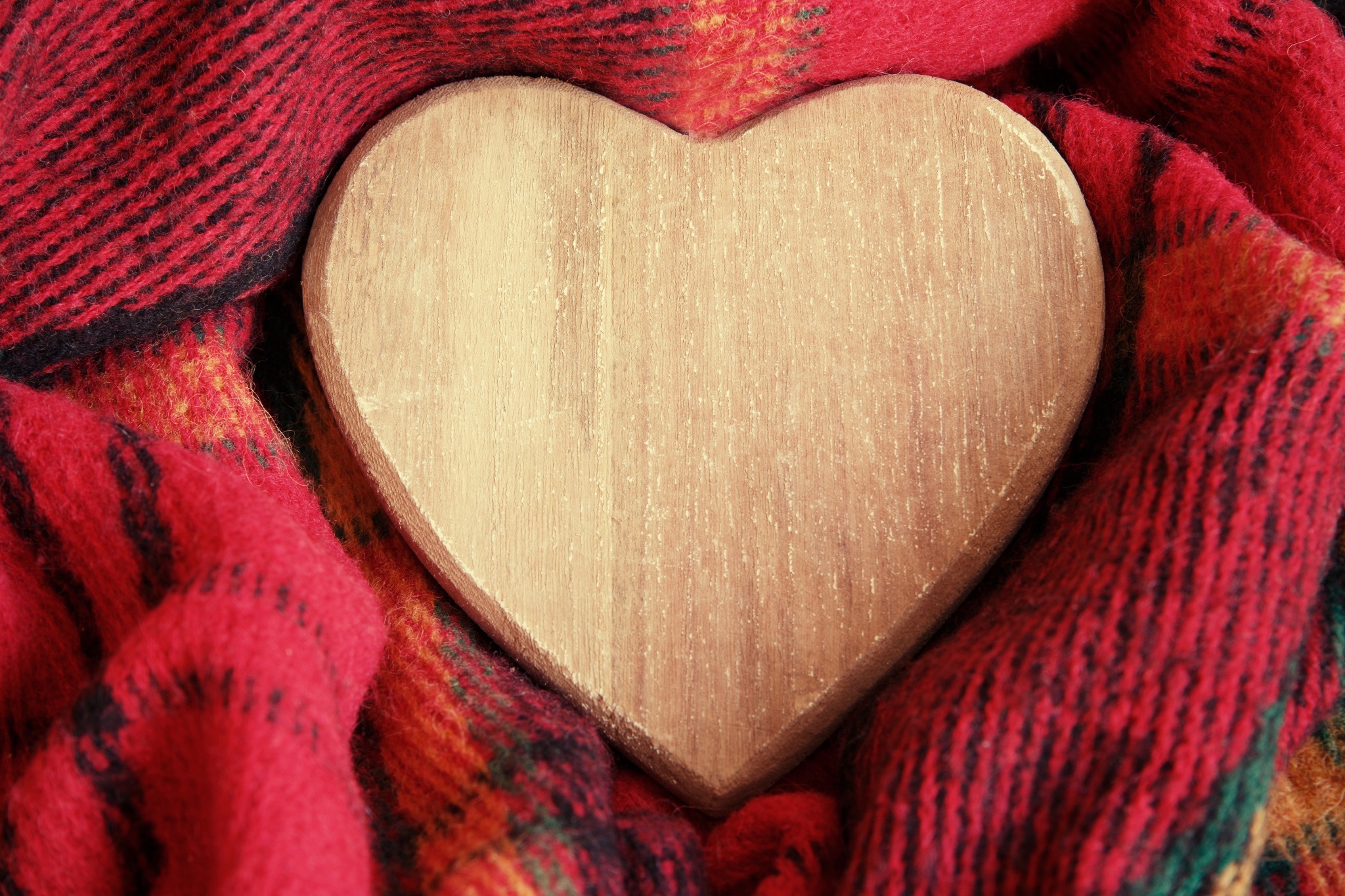 A wooden heart wrapped in tartan A wooden heart wrapped in tartan