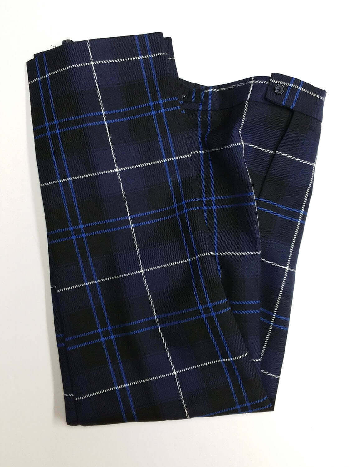 Tartan Trews and trousers folded on a white background from The Celtic Croft.
