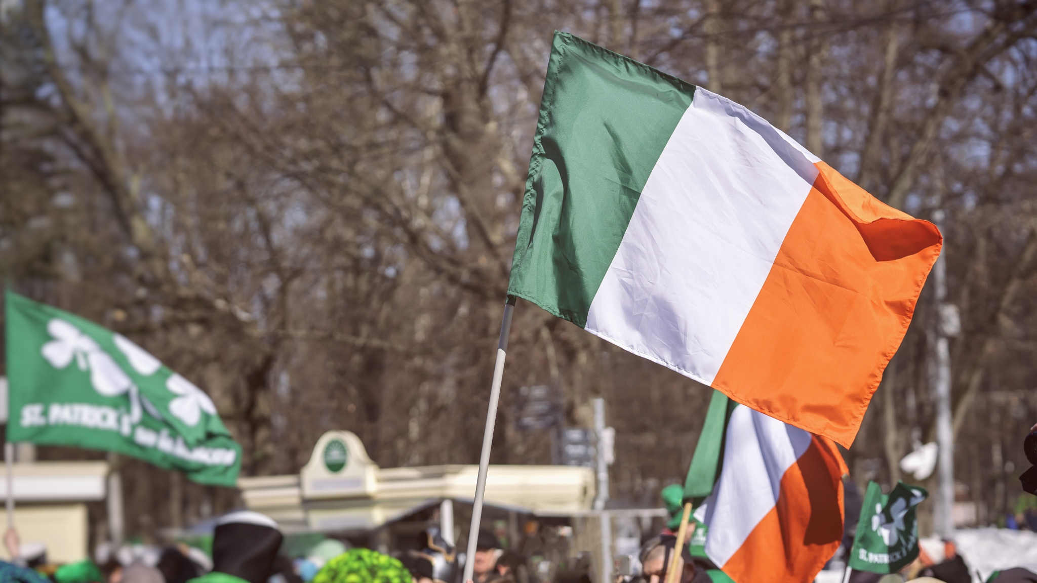 The Irish flag flying at a St. Patrick's day celebration. st. Patrick's Day is an ancient Celtic holiday still celebrated today.