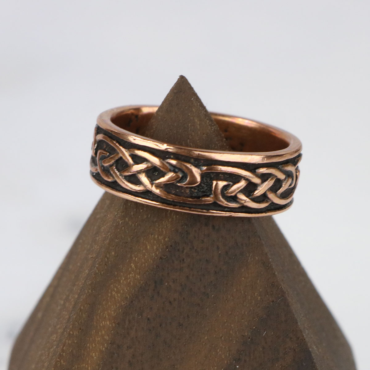 A copper Celtic knot wedding band from The Celtic Croft