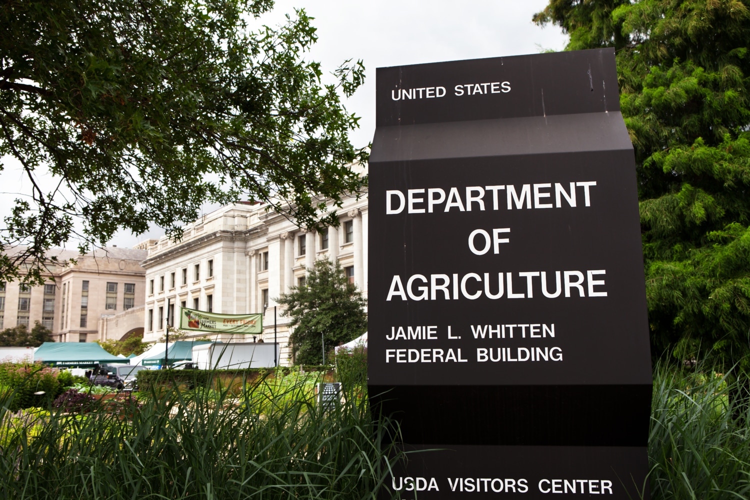 Exterior image of US Dept of Agriculture with sign.