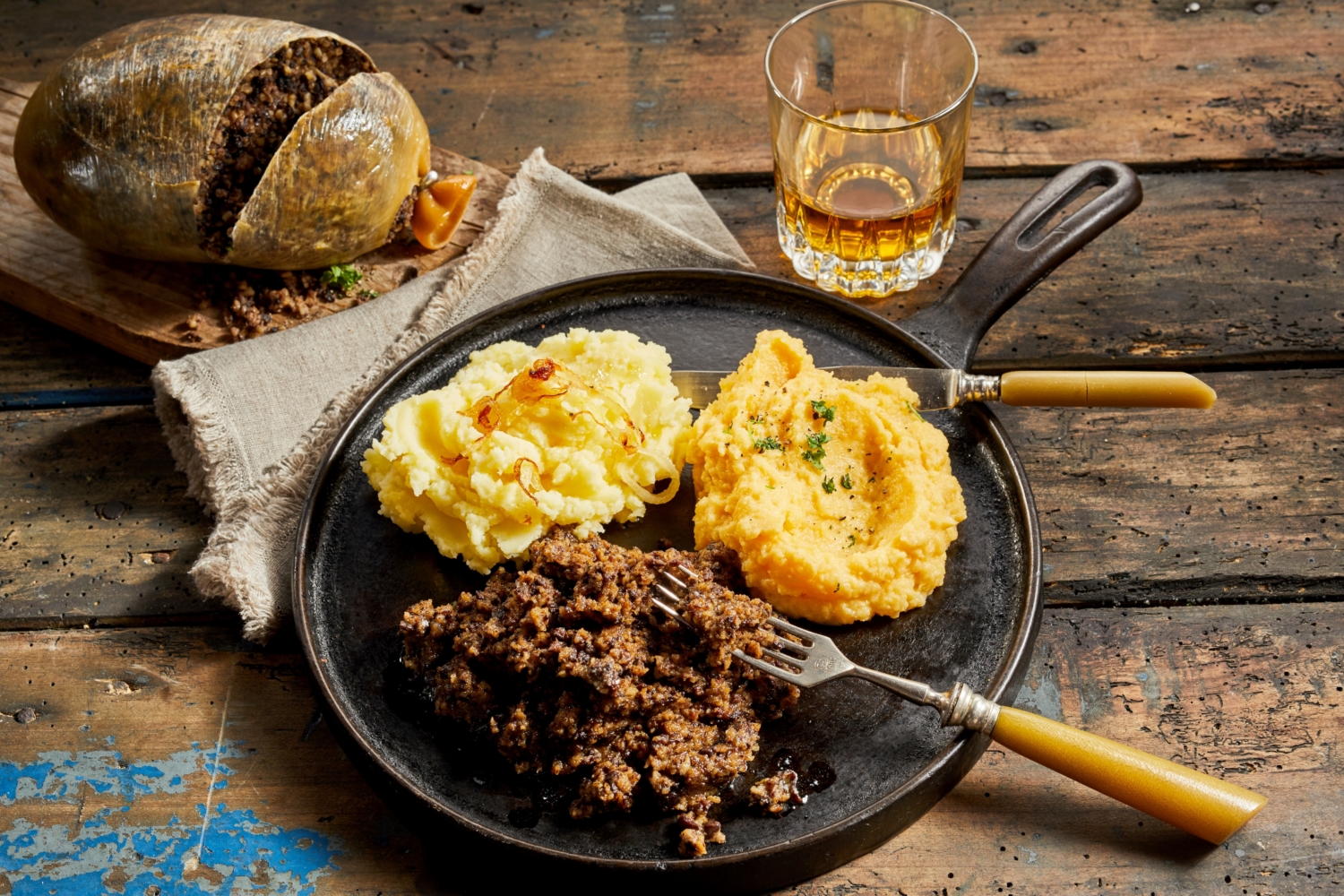 a traditional haggis meal, with whisky on the side